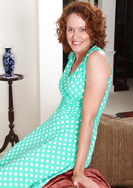 Hot aged Ajia Simpson uncovering small tits and spreading her legs 